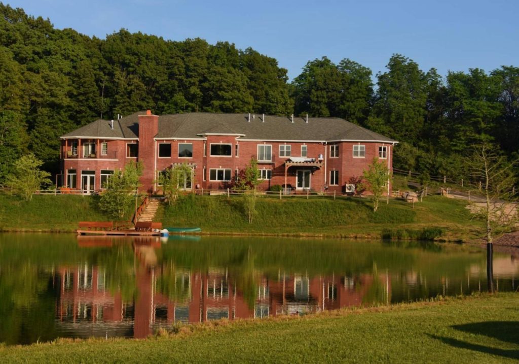 the ranch main lodge in front of lake