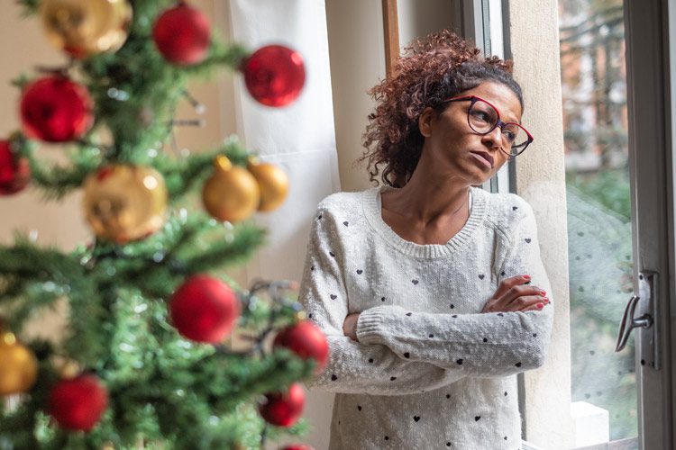 Woman coping with loneliness and addiction during the holidays