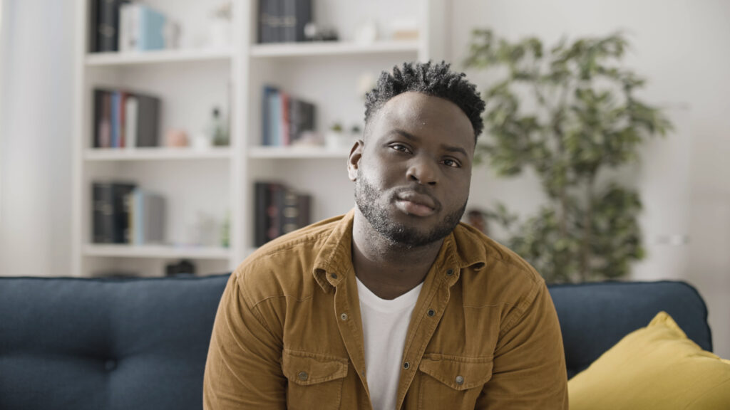 Portrait of a confident and sincere African American man sitting