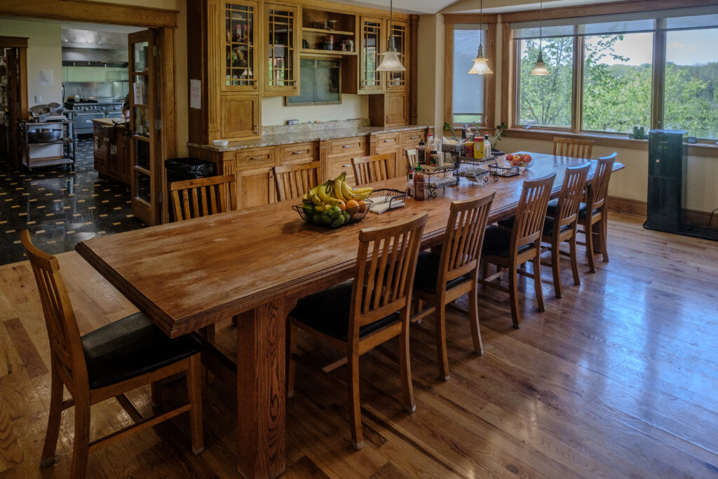 Bright dining room in the Main Lodge at Top of the World Ranch addiction rehab Milan IL, providing nourishing communal meals in a warm, home-like setting for recovery support.